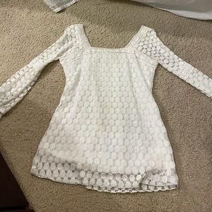 Whit crochet style top with tie detail on sleeves